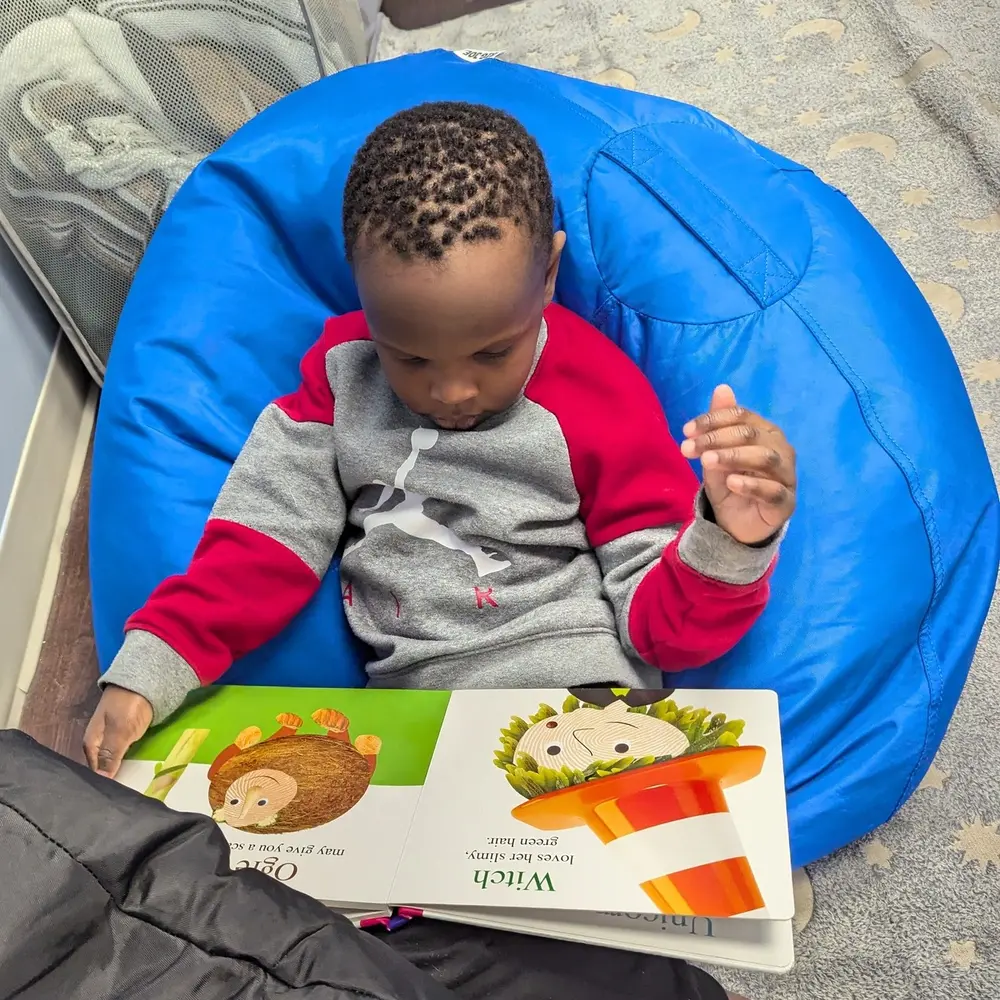 Child reading in a comfortable therapy setting