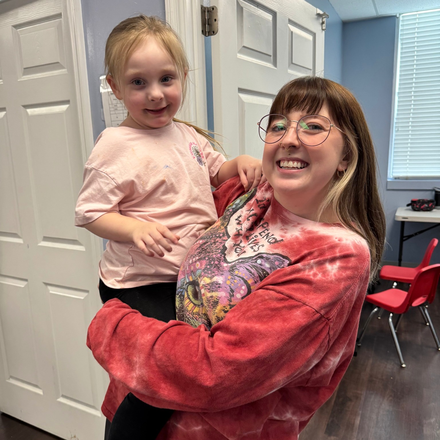 Children sharing a smile at Inquiring Minds